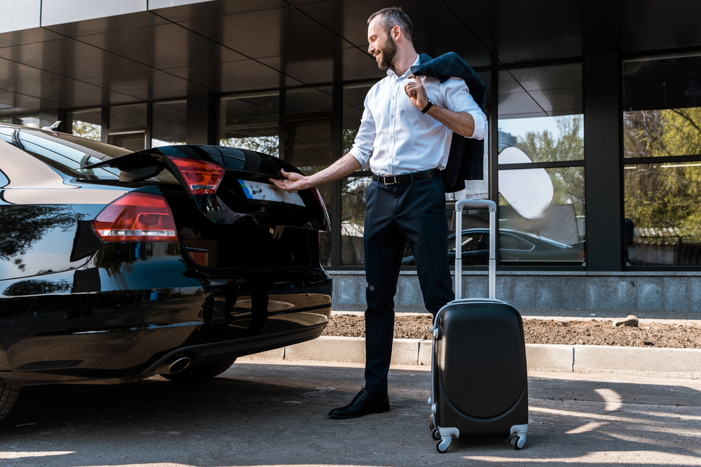 Man opening a rental car that is insured in winnipeg